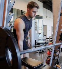 a man lifting weights in a gym